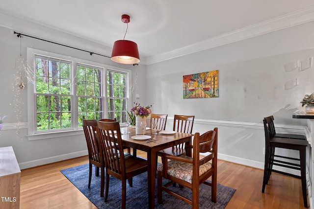 6 Chelan Ct, Durham, NC 27713 - dining room with healthy amount of natural light, light wood finished floors, crown molding, and baseboards