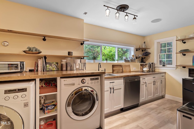 6 Chelan Ct, Durham, NC 27713 - washroom featuring washer / clothes dryer, light wood-type flooring, and baseboards