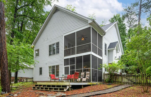 6 Chelan Ct, Durham, NC 27713 - rear view of property featuring a sunroom, a wooden deck, and a gate