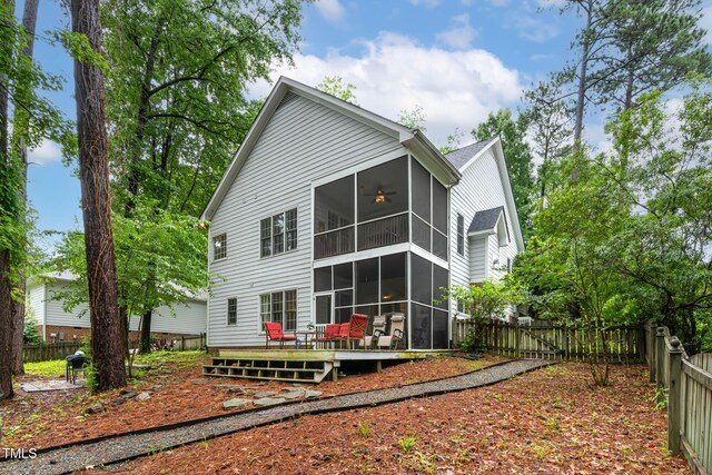 6 Chelan Ct, Durham, NC 27713 - back of property featuring a sunroom, a fenced backyard, a deck, and ceiling fan