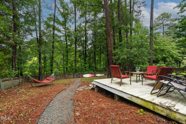 6 Chelan Ct, Durham, NC 27713 - fenced backyard with a wooden deck