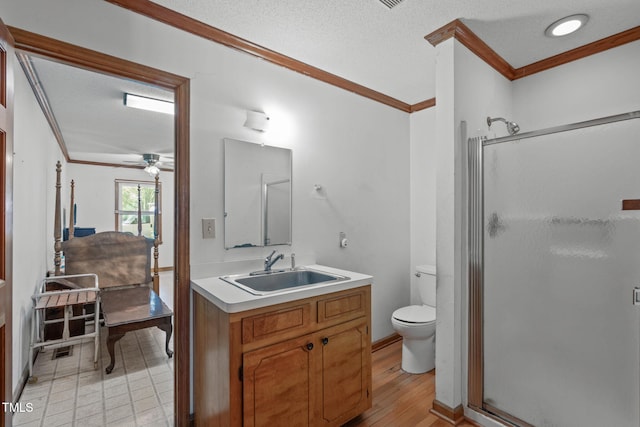 full bathroom featuring vanity, ornamental molding, and a stall shower