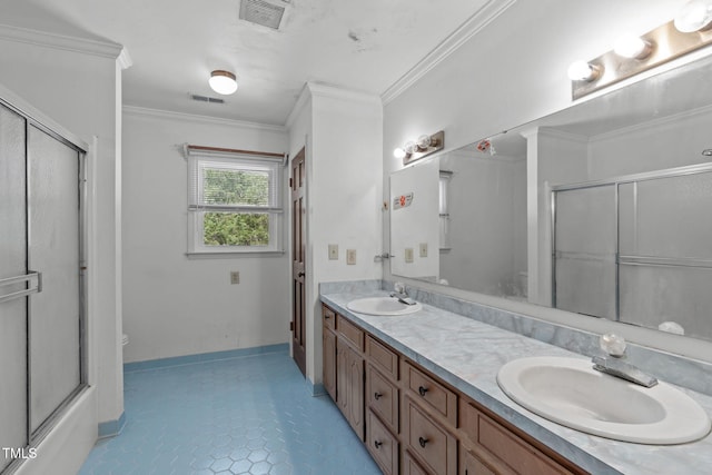 bathroom with visible vents, a sink, a shower with door, and toilet
