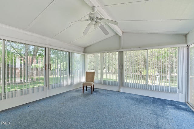 unfurnished sunroom with ceiling fan and beam ceiling
