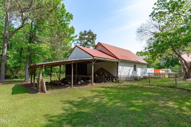 exterior space featuring fence and a carport