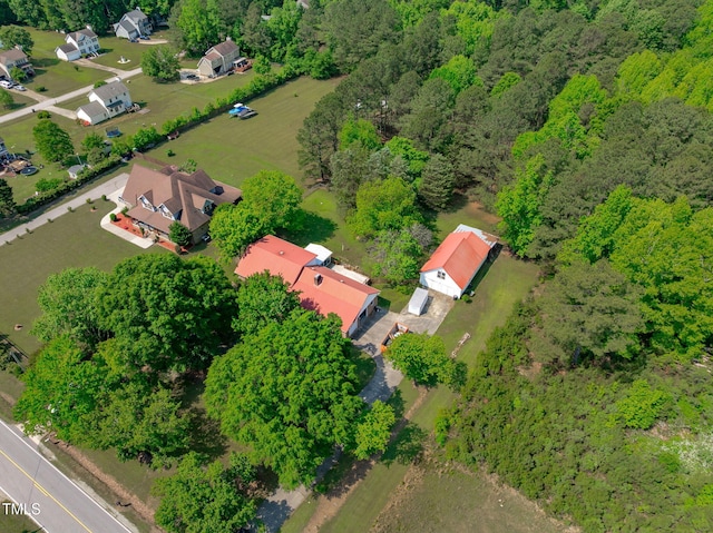 drone / aerial view featuring a view of trees