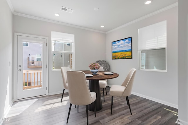 321 Devon Cliffs Dr, Wake Forest, NC 27587 - dining area featuring wood finished floors, crown molding, recessed lighting, and baseboards
