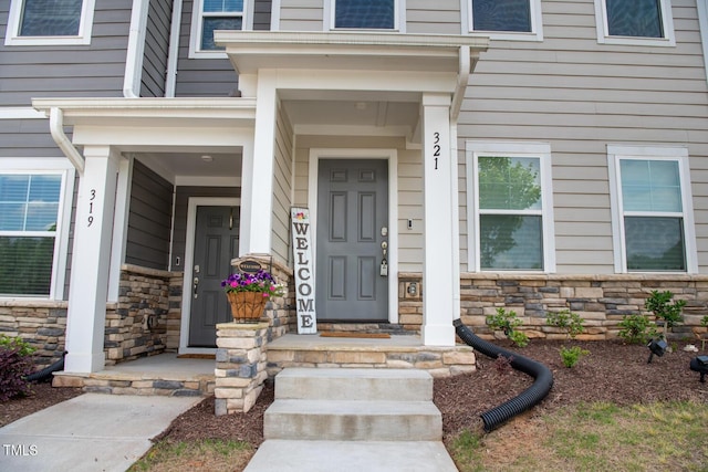 321 Devon Cliffs Dr, Wake Forest, NC 27587 - entrance to property featuring stone siding and covered porch