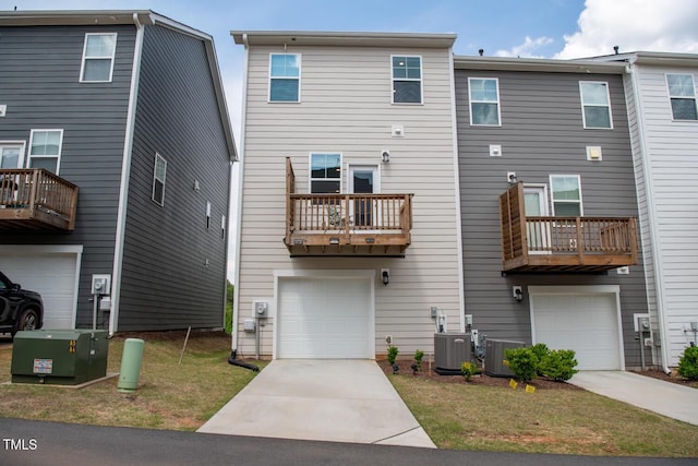 321 Devon Cliffs Dr, Wake Forest, NC 27587 - back of property featuring a garage, central AC, and driveway