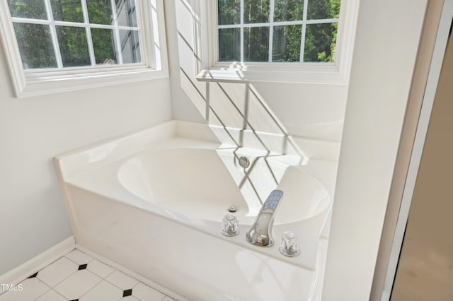 full bath with tile patterned floors and a garden tub