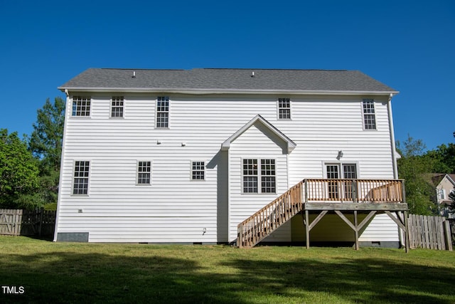 rear view of property with fence, a wooden deck, crawl space, a yard, and stairway
