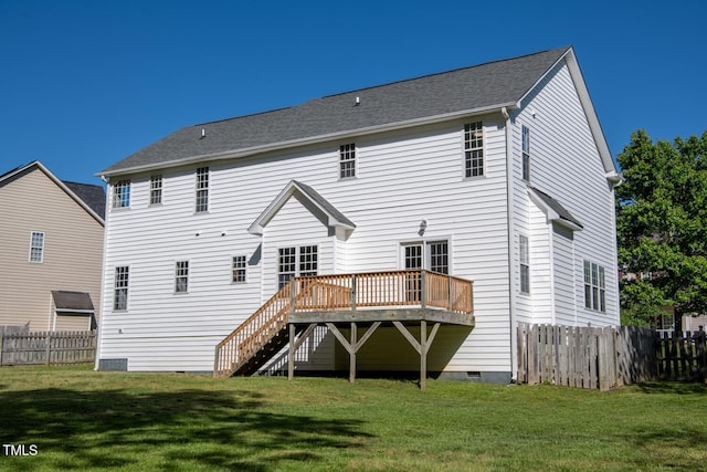 rear view of property featuring fence, a wooden deck, a lawn, and crawl space