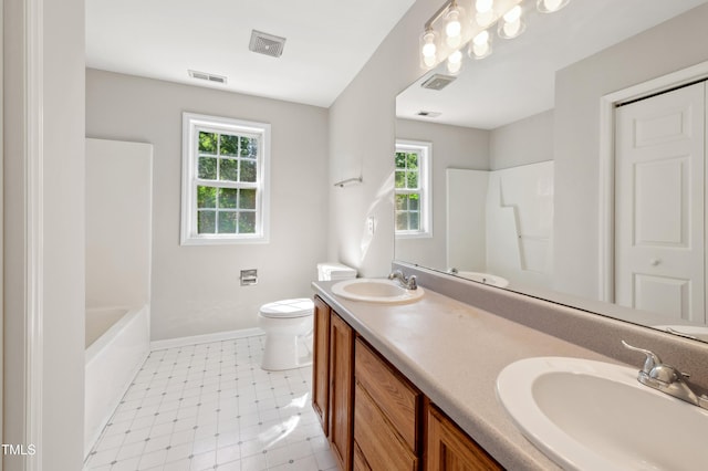 bathroom with visible vents, a sink, and a wealth of natural light