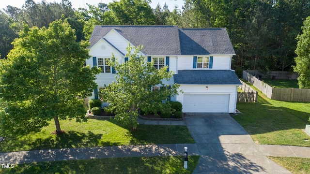 view of front facade featuring driveway, roof with shingles, a garage, fence, and a front lawn