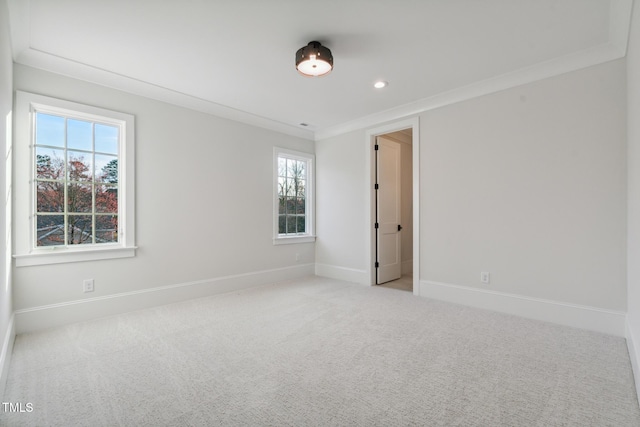 spare room featuring plenty of natural light, baseboards, recessed lighting, and carpet floors