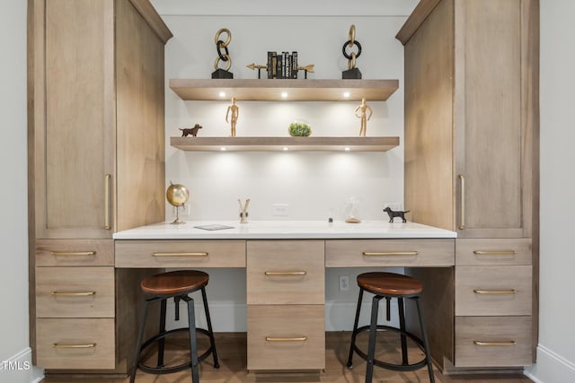 bar featuring baseboards