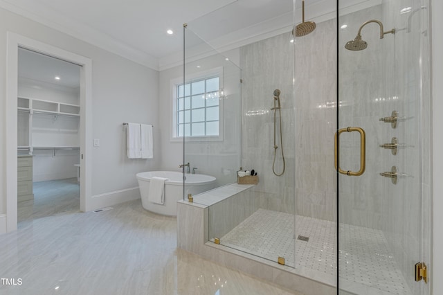 bathroom with recessed lighting, a freestanding bath, a shower stall, and baseboards