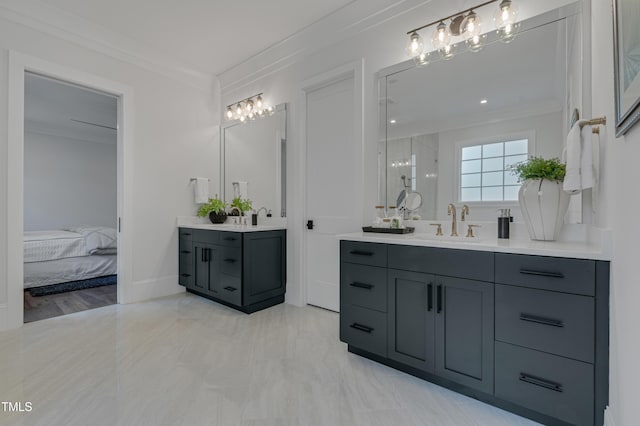 ensuite bathroom with a shower stall, a sink, two vanities, ornamental molding, and ensuite bath