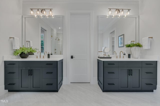 bathroom featuring a shower stall, two vanities, a notable chandelier, and a sink