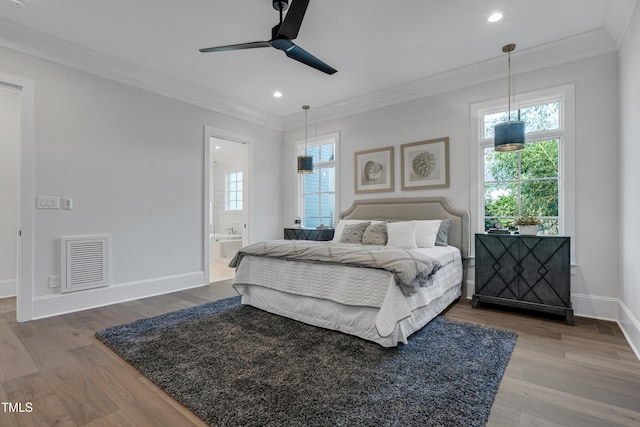 bedroom with recessed lighting, visible vents, baseboards, ornamental molding, and wood finished floors