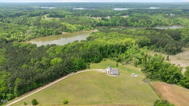 675 Anderson Creek Rd, Henderson, NC 27537 - drone / aerial view with a water view and a wooded view