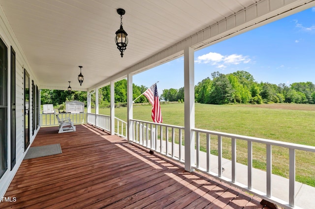 675 Anderson Creek Rd, Henderson, NC 27537 - wooden deck with a porch, a yard, and a storage unit