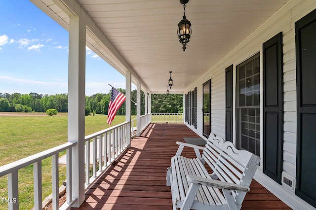 675 Anderson Creek Rd, Henderson, NC 27537 - deck featuring a porch and a yard