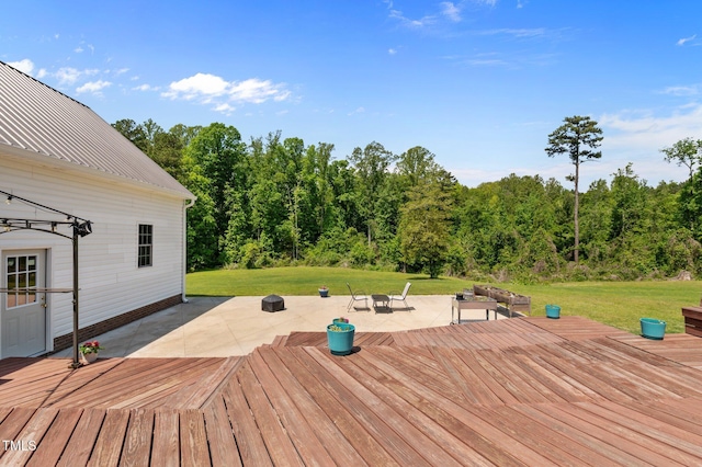 675 Anderson Creek Rd, Henderson, NC 27537 - deck with a lawn, a view of trees, a fire pit, and a patio area