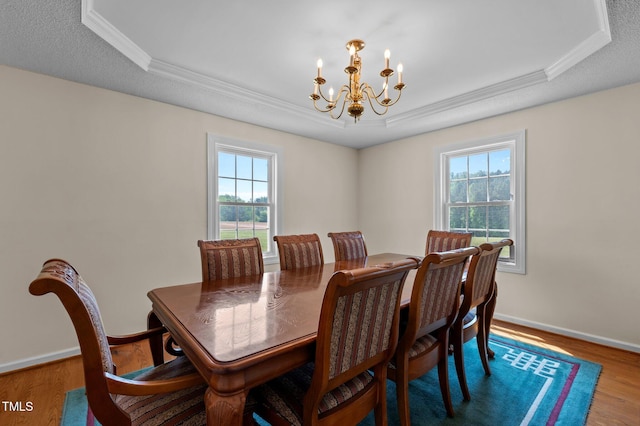 675 Anderson Creek Rd, Henderson, NC 27537 - dining area with crown molding, an inviting chandelier, a wealth of natural light, and a raised ceiling