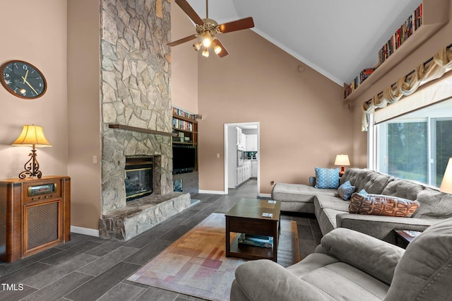 675 Anderson Creek Rd, Henderson, NC 27537 - living room with a ceiling fan, a fireplace, wood finish floors, high vaulted ceiling, and baseboards