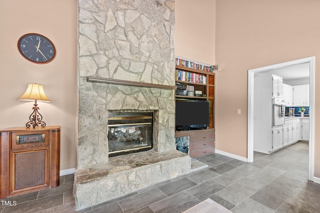 675 Anderson Creek Rd, Henderson, NC 27537 - living room featuring baseboards and a fireplace