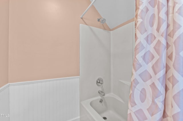 675 Anderson Creek Rd, Henderson, NC 27537 - full bath with shower / bath combo with shower curtain and a wainscoted wall