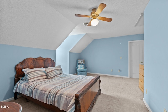 675 Anderson Creek Rd, Henderson, NC 27537 - bedroom with ceiling fan, a textured ceiling, baseboards, lofted ceiling, and carpet