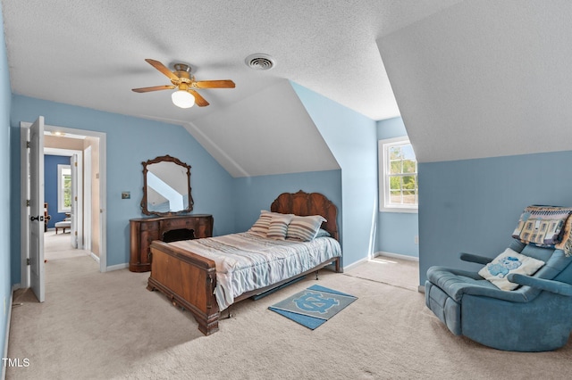 675 Anderson Creek Rd, Henderson, NC 27537 - carpeted bedroom with baseboards, a ceiling fan, vaulted ceiling, and visible vents