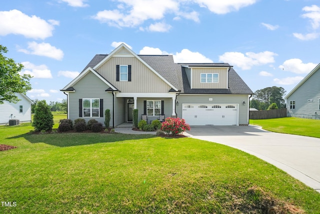 craftsman-style home featuring fence, a garage, central AC, a front lawn, and concrete driveway