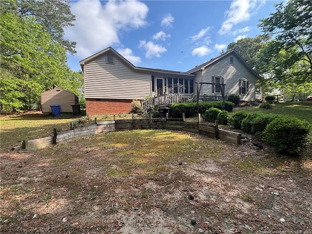 3903 Daytona Rd, Fayetteville, NC 28311 - rear view of property with a wooden deck, crawl space, a storage unit, and an outdoor structure