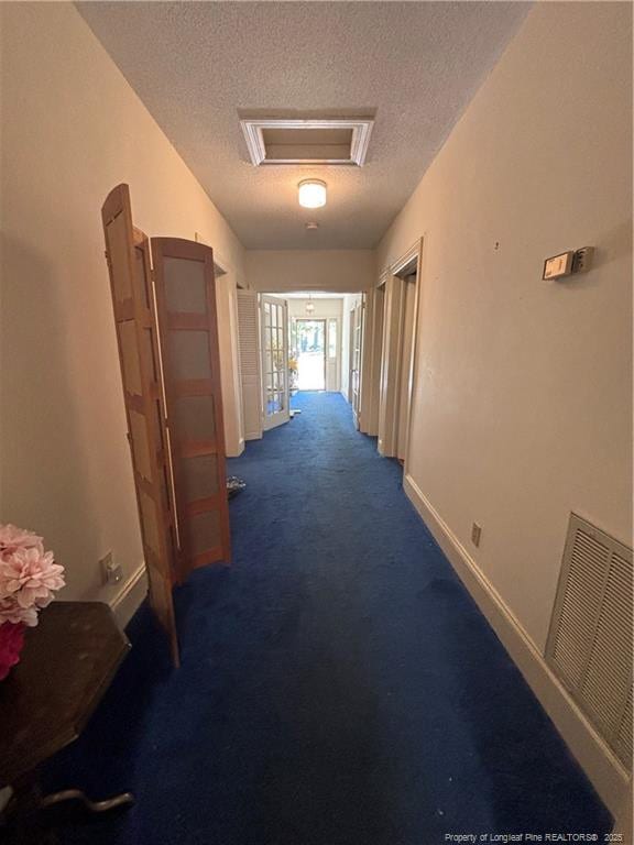 3903 Daytona Rd, Fayetteville, NC 28311 - hallway with a textured ceiling, baseboards, and carpet