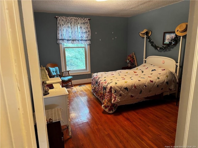 3903 Daytona Rd, Fayetteville, NC 28311 - bedroom featuring wood finished floors and a textured ceiling