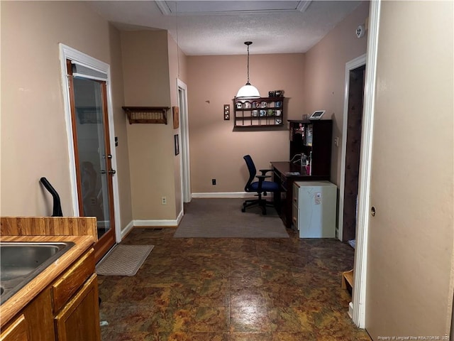 3903 Daytona Rd, Fayetteville, NC 28311 - office space with attic access, a sink, stone finish flooring, and baseboards
