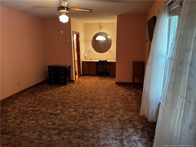 3903 Daytona Rd, Fayetteville, NC 28311 - unfurnished room featuring ceiling fan, dark colored carpet, baseboards, and a sink