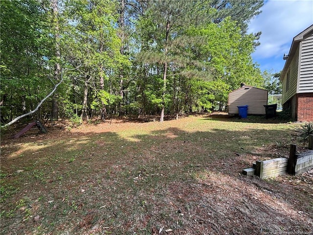 3903 Daytona Rd, Fayetteville, NC 28311 - view of yard with an outdoor structure and a storage shed