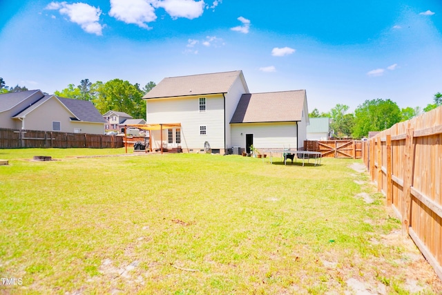 145 Ironwood Way, Raeford, NC 28376 - rear view of house with a fenced backyard and a yard