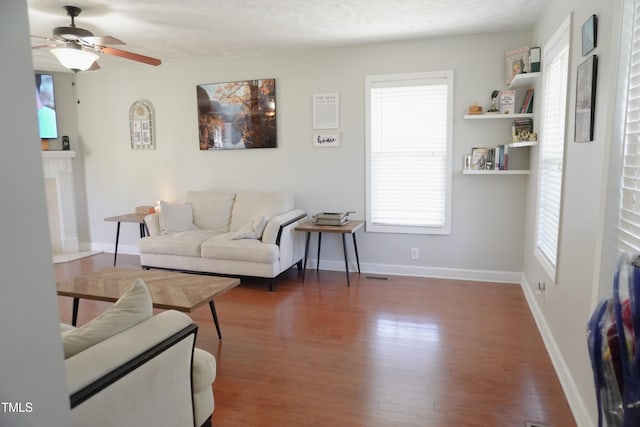 145 Ironwood Way, Raeford, NC 28376 - living room with ceiling fan, baseboards, wood finished floors, and a fireplace
