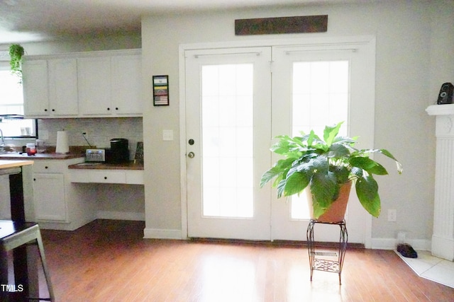 145 Ironwood Way, Raeford, NC 28376 - doorway to outside featuring baseboards and light wood-type flooring