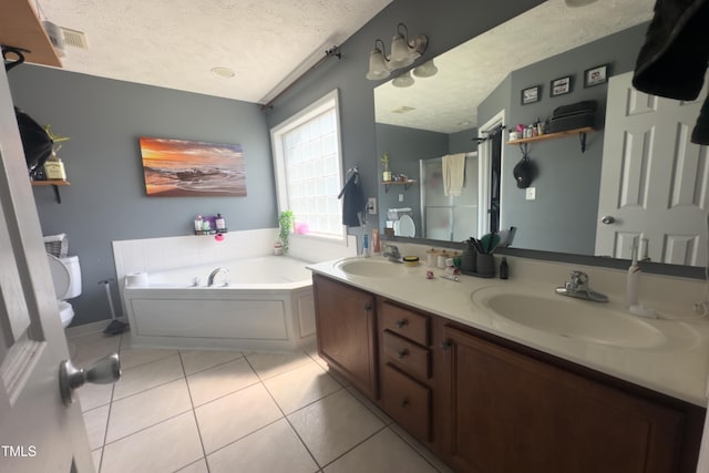 145 Ironwood Way, Raeford, NC 28376 - full bath featuring tile patterned floors, a textured ceiling, a bath, and a sink