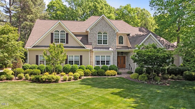 7212 Donneeford Rd, Wake Forest, NC 27587 - view of front of property with a front lawn and roof with shingles