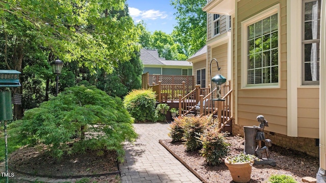 7212 Donneeford Rd, Wake Forest, NC 27587 - view of yard with a wooden deck and a patio area