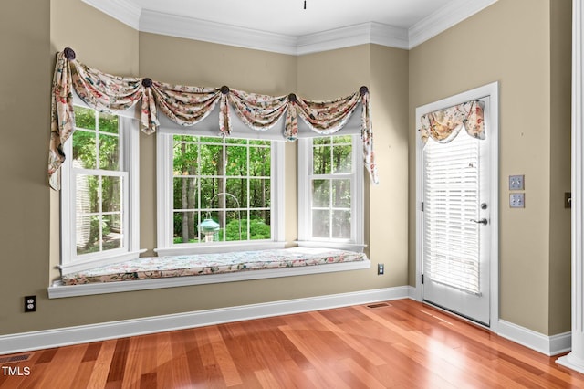 7212 Donneeford Rd, Wake Forest, NC 27587 - entrance foyer with baseboards, wood finished floors, and crown molding