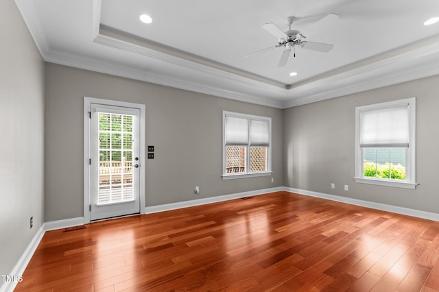 7212 Donneeford Rd, Wake Forest, NC 27587 - empty room with a tray ceiling, ornamental molding, wood finished floors, ceiling fan, and recessed lighting