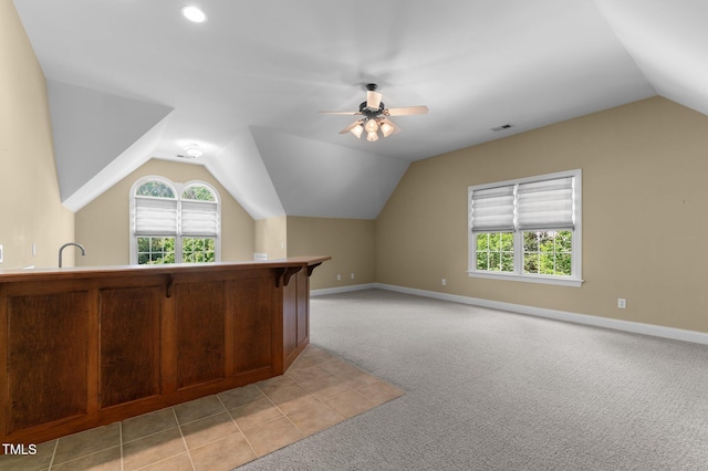 7212 Donneeford Rd, Wake Forest, NC 27587 - bonus room featuring vaulted ceiling, light carpet, plenty of natural light, and a ceiling fan